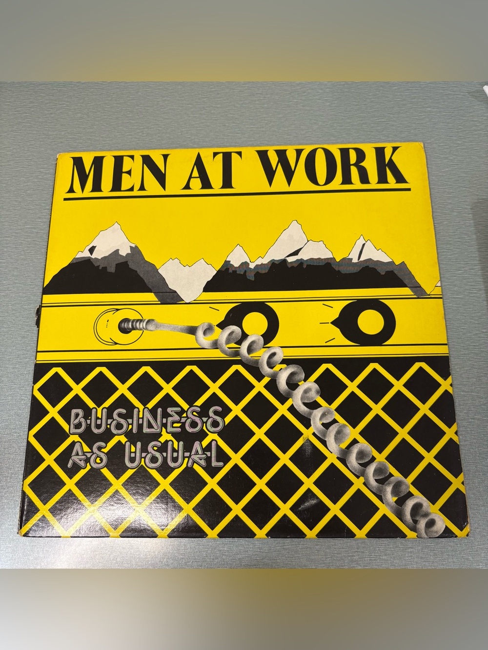Men At Work "Business As Usual" Yellow & Black Album Cover